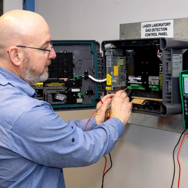 Industrial electrician doing gas detection testing