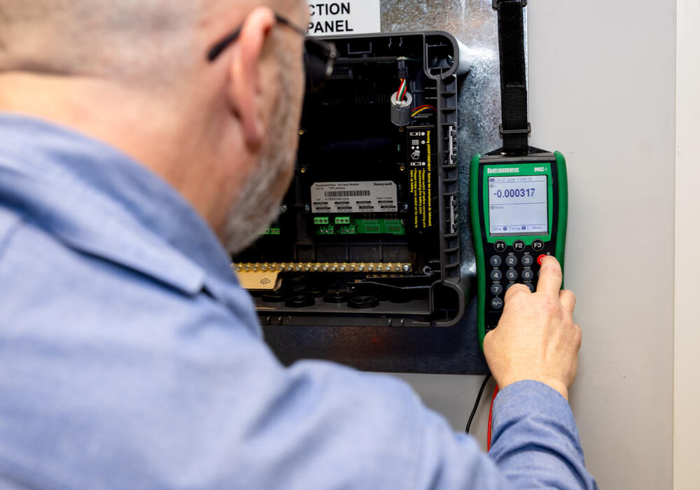 Industrial electrician doing gas detection testing