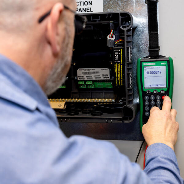 Industrial electrician doing gas detection testing
