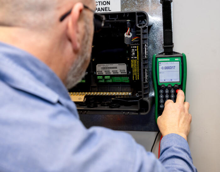 Industrial electrician doing gas detection testing