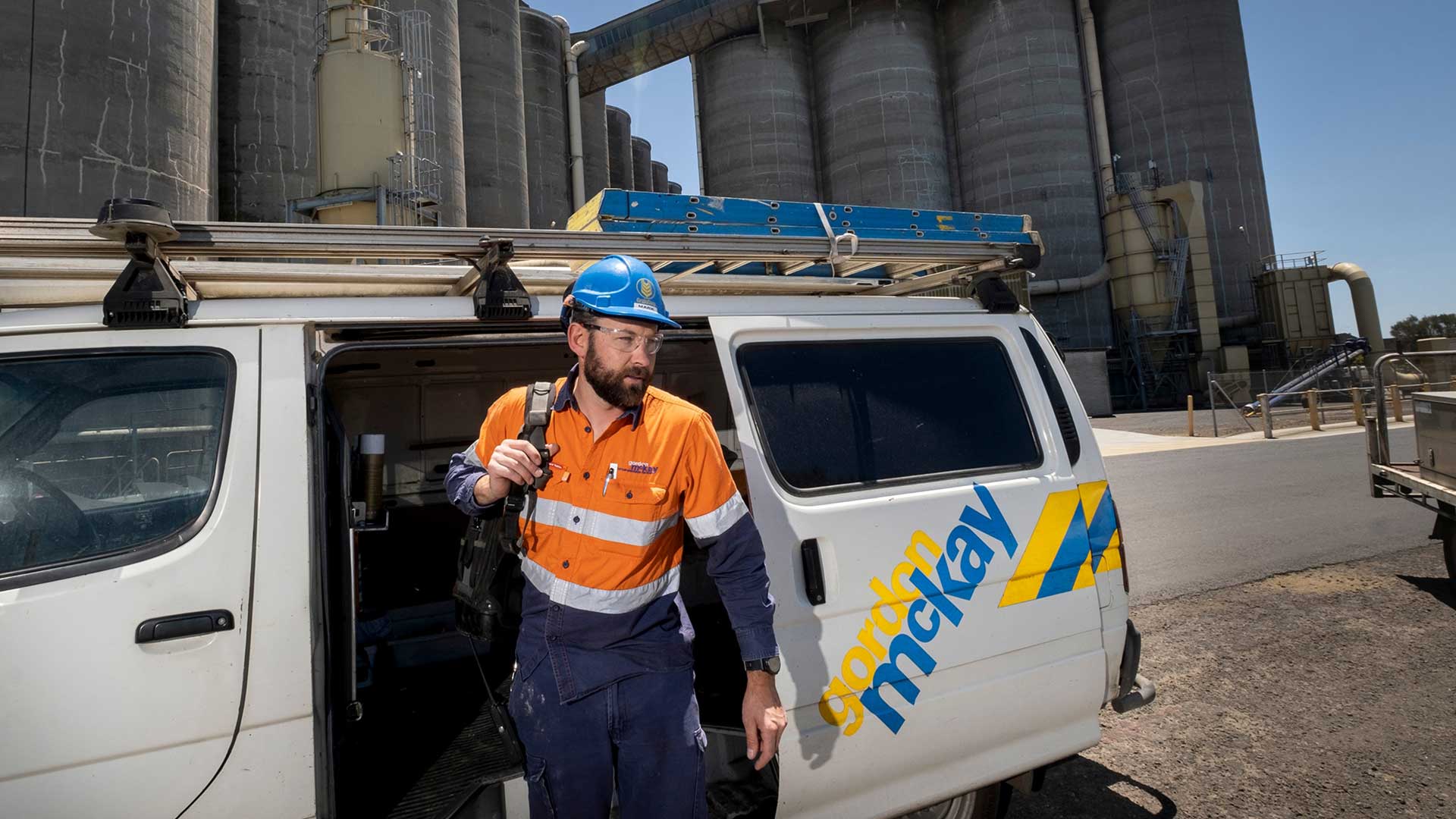 Gordon McKay industrial electrician emerging from a van